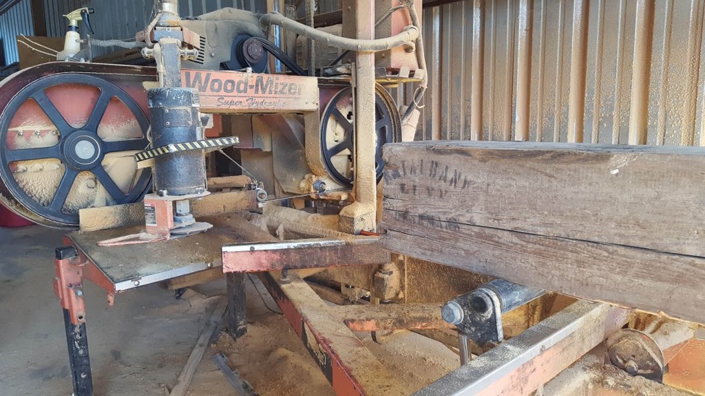Wood-Mizer cutting a historic pine beam.