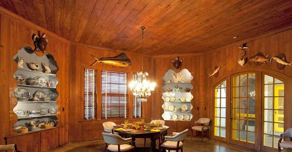 Dade county pine wood walls and windows at The Bonnet House Dining Room in Key West, Fl.