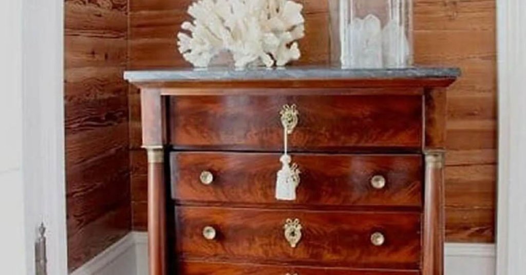 Dade county pine wall surround a vintage bureau.
